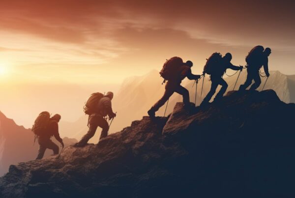 leader leading a team up a mountain